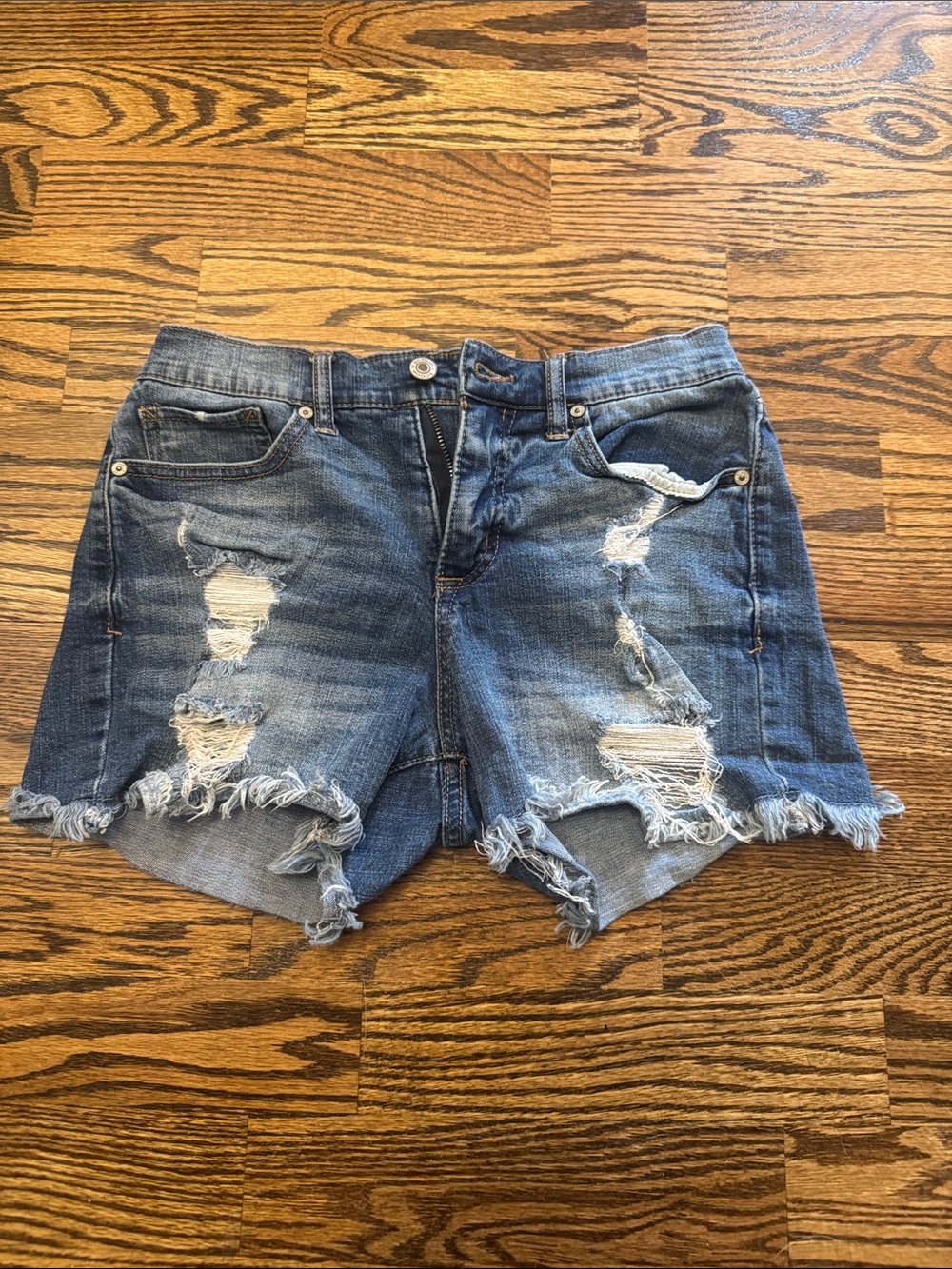 Women's Distressed Blue Denim Shorts with Frayed Hemline